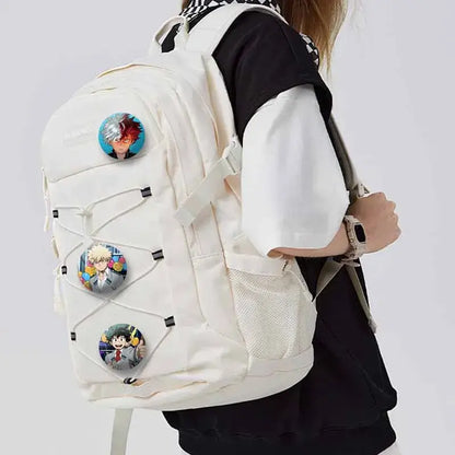 Cream-colored canvas backpack with three my hero academia tinplate coin brooch anime character pins on front