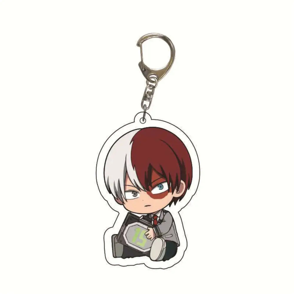 Translucent acrylic hero academia keychain featuring a chibi character with half red and white hair holding device marked 15