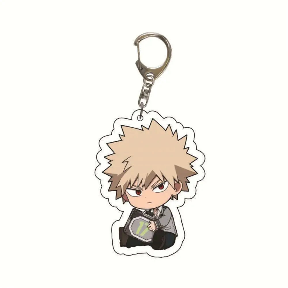 Chibi-style Bakugo acrylic keychain with spiky blonde hair in gray school uniform holding octagonal device hero academia bag charm