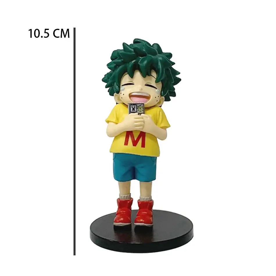 A 10.5 cm tall green haired izuku midoriya chibi pvc figurine from my hero academia in yellow shirt and blue shorts