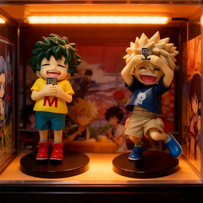 Two colorful detailed My Hero Academia chibi pvc figurines with spiky hair on black circular bases in display case