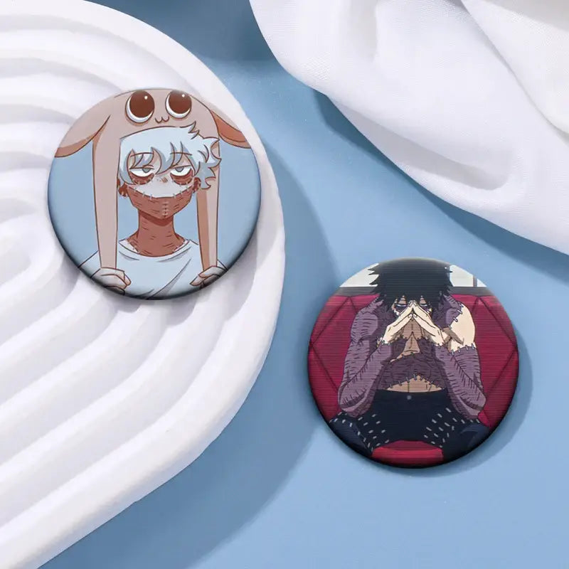 Two circular hero academia dabi button pins featuring a white-haired bunny character on blue and a dark-haired one on red
