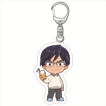Silver-toned acrylic keychain featuring chibi deku from my hero academia holding an orange drink in a clear glass
