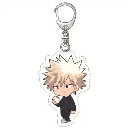 Clear acrylic hero academia keychain featuring chibi spiky blonde character in black outfit holding white object