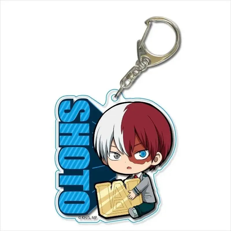 Chibi shoto todoroki acrylic keychain with red and white hair holding golden a emblem beside blue hero academia lettering zinc alloy