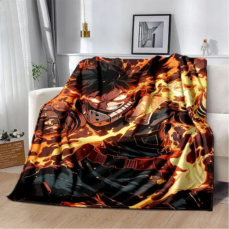 A vibrant flame-themed hero academia deku bakugo flannel blanket with fiery orange and yellow flames swirl design