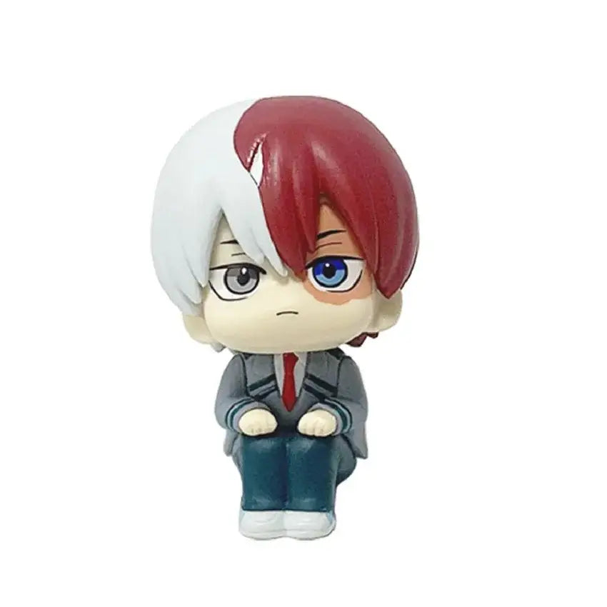 Chibi-style shoto todoroki pvc figure from hero academia with half-white half-red hair blue eyes in a gray uniform seated
