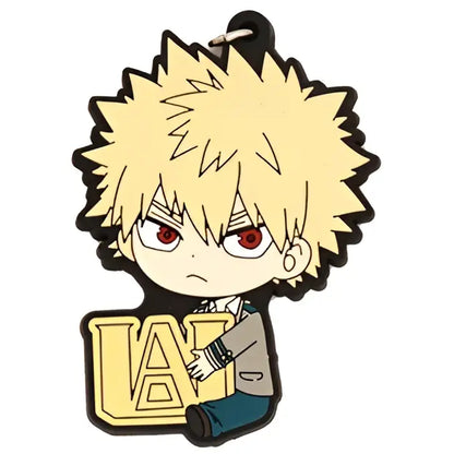 Yellow spiky-haired deku rubber keychain from hero academia with red eyes holding a gold u.a. emblem in pvc material