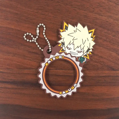 Brown and orange gear-shaped rubber keychain featuring chibi bakugo with spiky hair and lightning bolts from hero academia