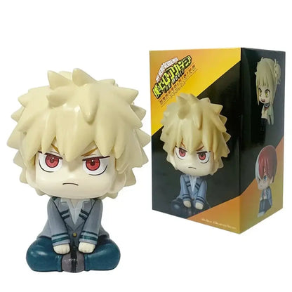 Chibi-style hero academia anime figure of bakugo with spiky blonde hair red eyes in gray school uniform sitting cross-legged