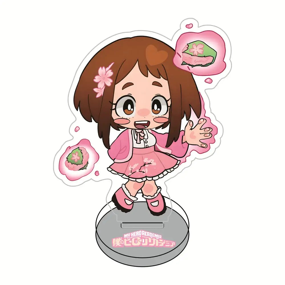 Pink and white chibi-style acrylic standee of hero academia sakura girl with brown hair in pink dress surrounded by cherry blossom sweets