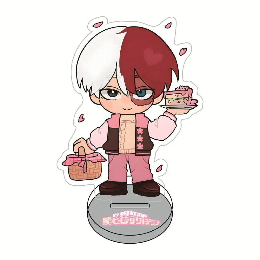 A chibi hero academia sakura acrylic stand figure of shoto todoroki with half-white half-red hair holding cake