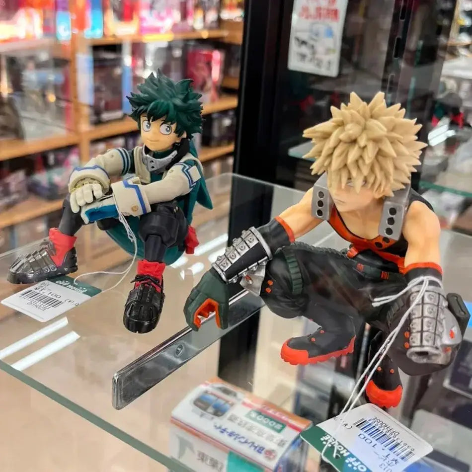 Two detailed pvc hero academia premium version figurines featuring green spiky hair and blonde spiky hair characters