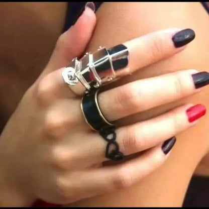 A bold multi-layered silver punk armor ring with a black enamel band and geometric detailing for gothic style
