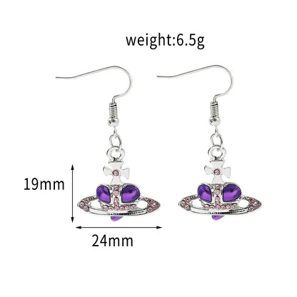 Silver plated dangle nana oosaki saturn planet earrings with purple gemstones and pink rhinestones inspired by vivienne westwood orbital