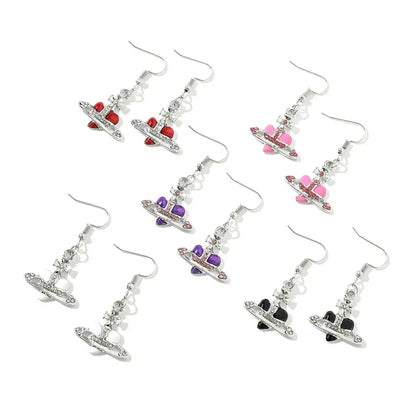 Silver plated saturn planet earrings with colorful enamel hearts in red pink purple and black by nana oosaki cz heart