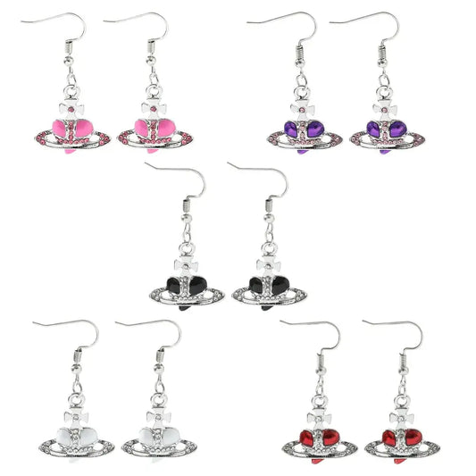 Silver plated saturn planet earrings with colorful pink purple black white and red cz heart charms by nana oosaki