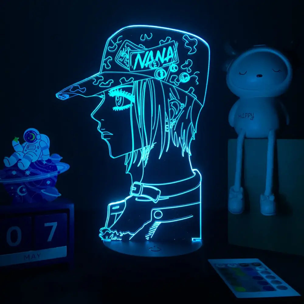 Glowing blue led night light shaped like nana osaki wearing a cap with nana text for manga table lamp use