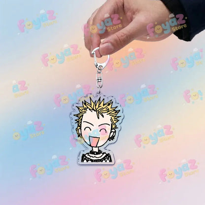 Clear acrylic nana osaki chibi keychain with spiky blonde hair and open mouth as a cute bag charm accessory