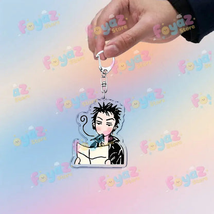 Clear acrylic nana osaki cute chibi keychain with spiky black hair and pink blush holding book bag charm accessory
