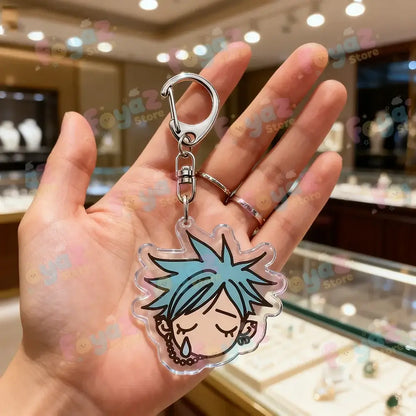 Clear acrylic nana osaki keychain with spiky light blue hair and silver clasp as a bag charm accessory