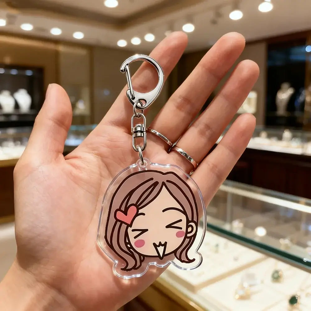 Clear acrylic nana osaki bag charm featuring a cute chibi girl with brown hair and pink heart accessory