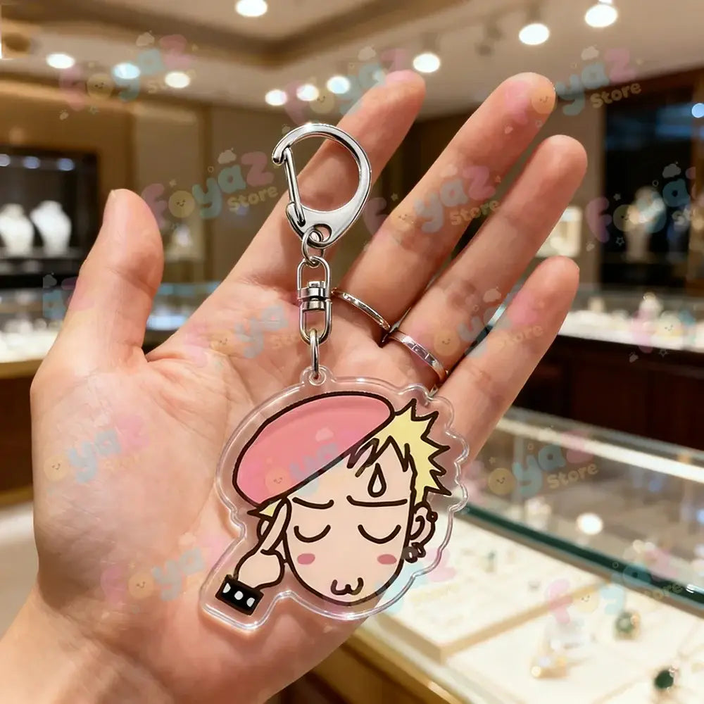 Clear acrylic nana osaki chibi keychain featuring a cute cartoon with spiky blonde hair and pink beret bag charm