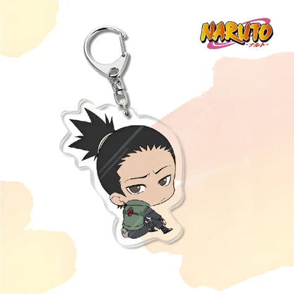 Clear acrylic naruto acrylic keychain featuring chibi naruto with black hair and green jacket bag charm accessory