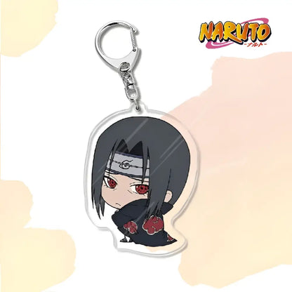 Clear acrylic naruto acrylic keychain featuring chibi sasuke with red eyes and akatsuki cloak bag charm accessory