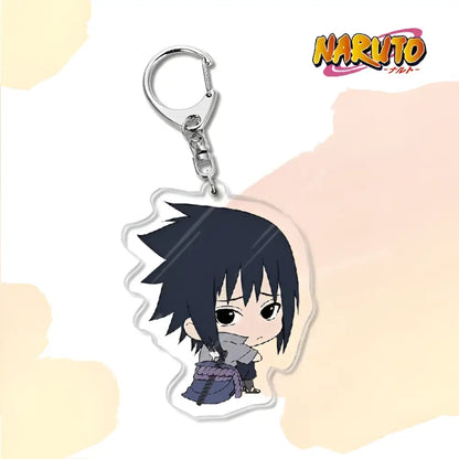 Clear acrylic naruto acrylic keychain featuring chibi sasuke uchiha in blue outfit as a bag charm accessory