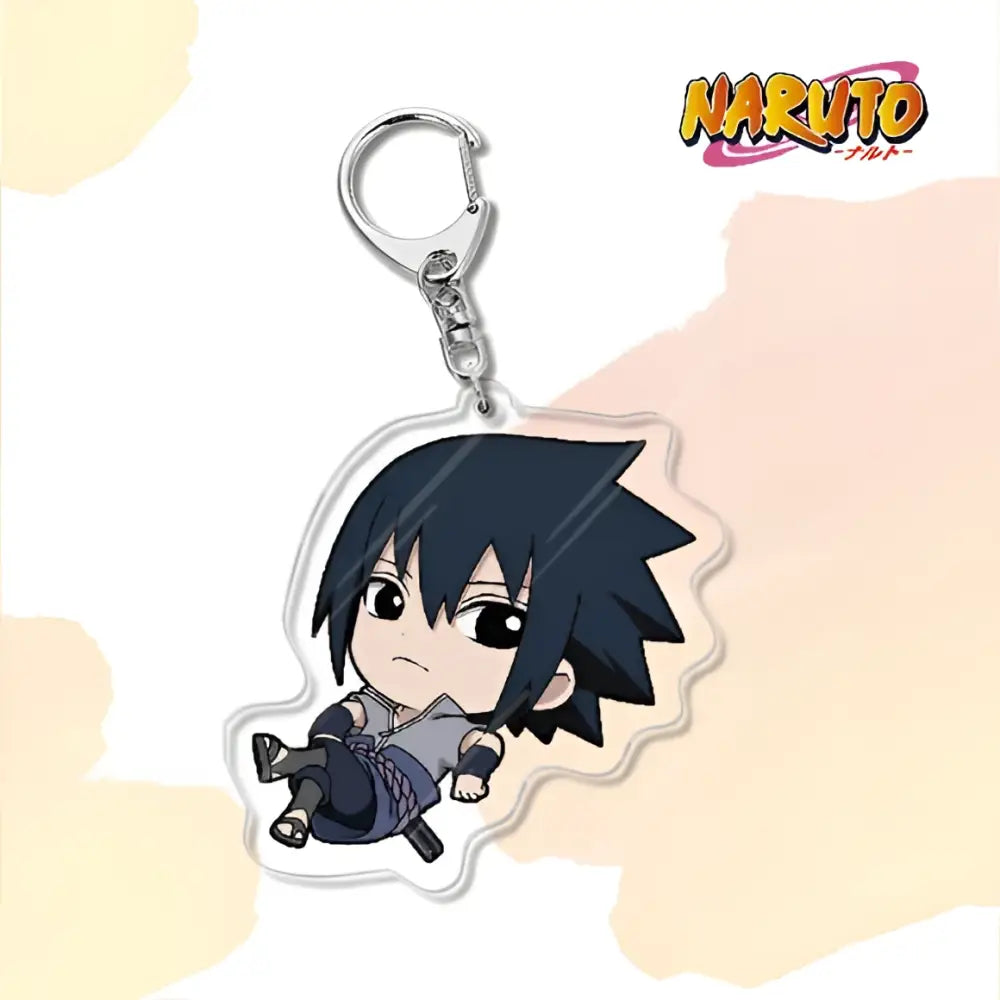 Clear acrylic naruto acrylic keychain featuring chibi sasuke in dark blue outfit as a bag charm accessory