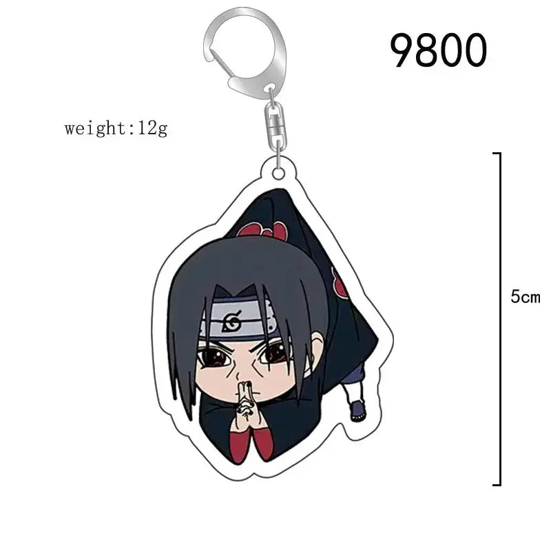 Black and red acrylic naruto acrylic keychain featuring chibi sasuke uchiha with headband and cloak as bag charm accessory