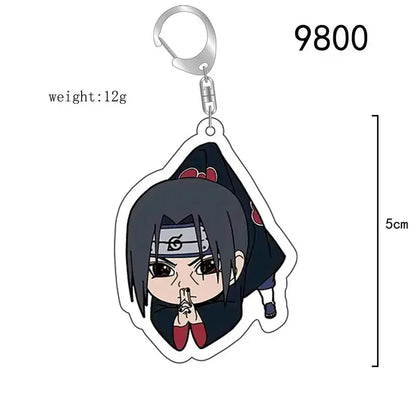 Black and red acrylic naruto acrylic keychain featuring chibi sasuke uchiha with headband and cloak as bag charm accessory