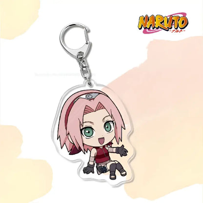 Clear acrylic naruto acrylic keychain featuring chibi sakura haruno with pink hair as a bag charm accessory