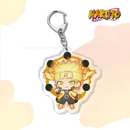 Chibi naruto acrylic keychain with golden hair black g headband and orange jacket bag charm accessory on clear acrylic
