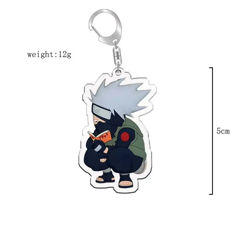 Translucent naruto acrylic keychain featuring chibi kakashi hatake reading an orange book bag charm accessory