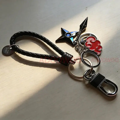 Naruto akatsuki alloy keychain with black braided leather rope and metallic red cloud shuriken charms and silver clip