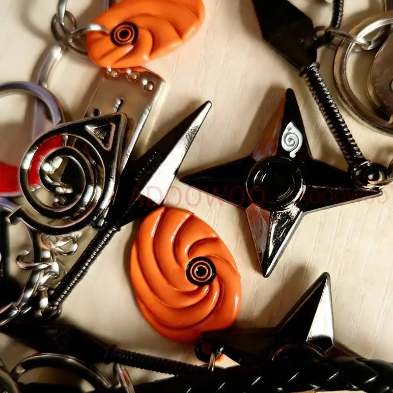 Orange spiral-shaped alloy keychain with black center detail from naruto akatsuki red cloud leather rope collection