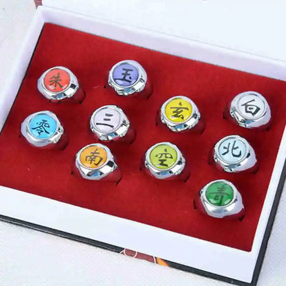 Set of nine colorful silver-toned metal rings with chinese characters from the akatsuki ring set for cosplay use