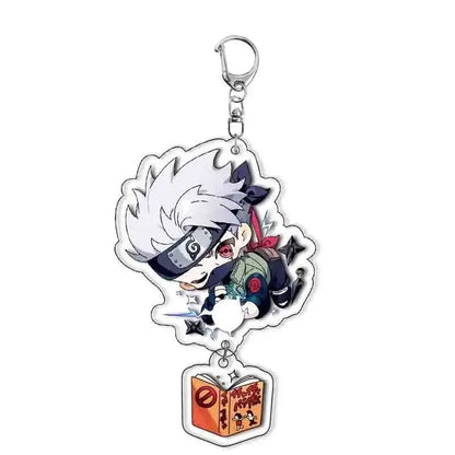 Translucent acrylic keychain featuring chibi kakashi hatake from naruto with white hair and kunai above orange book charm