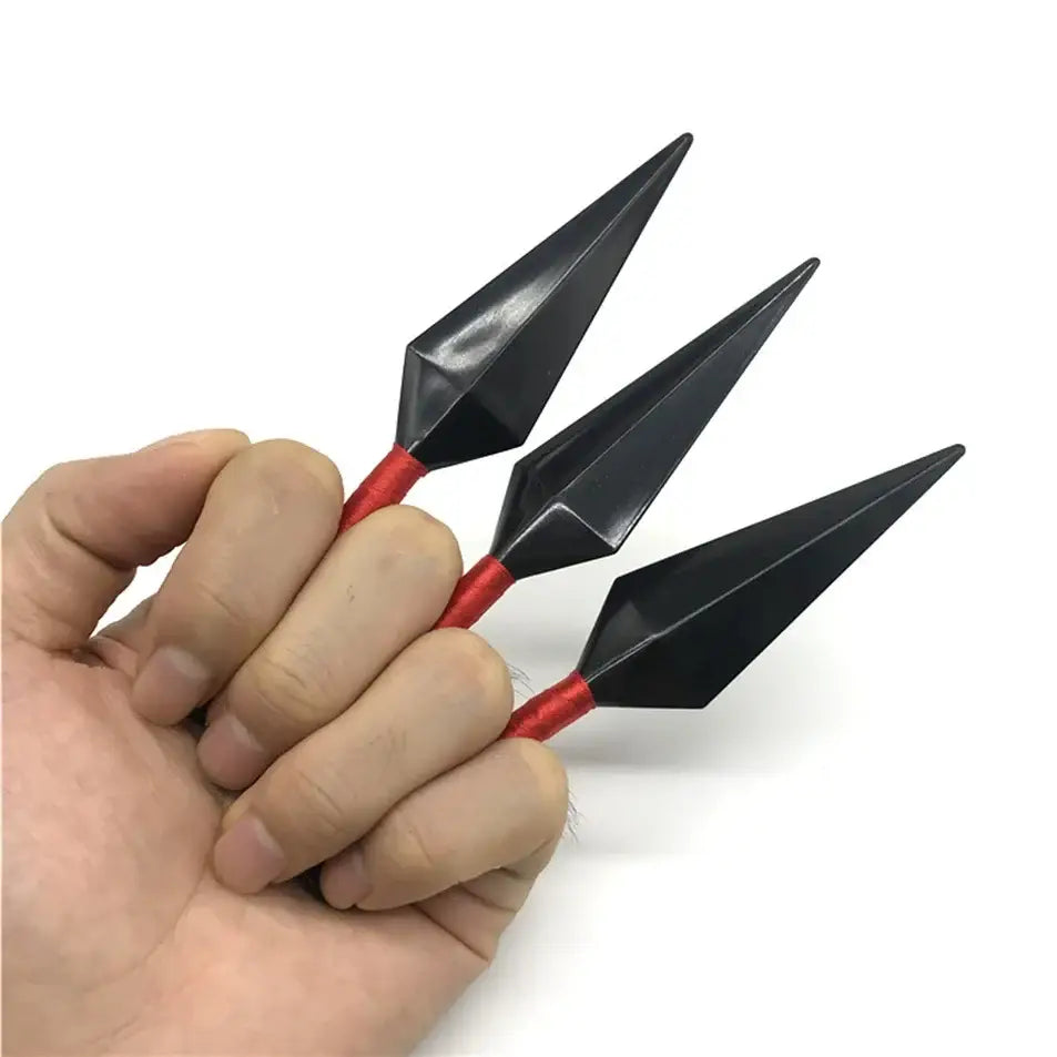 Black and red naruto kunai cosplay set with sharp pointed tips held in hand for ninja weapon roleplay