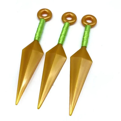 Three golden pvc kunai model knives with green textured handles and gold rings for durable shuriken kunai model display