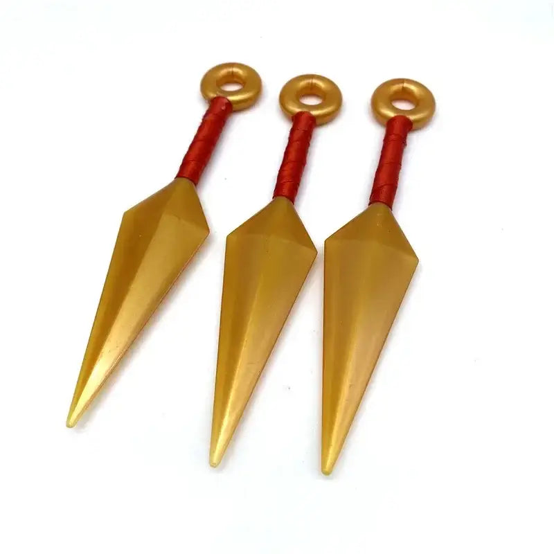 Three golden pvc kunai model knives with red textured handles and gold rings for naruto shuriken kunai model collection