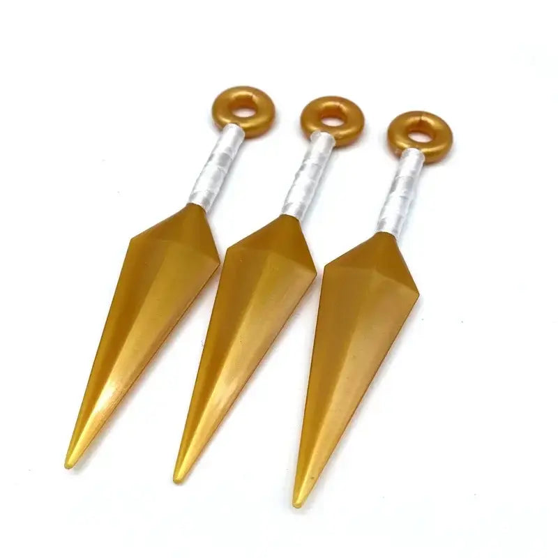 Three golden pvc kunai model knives with silver handles and rings featured in naruto shuriken kunai model set