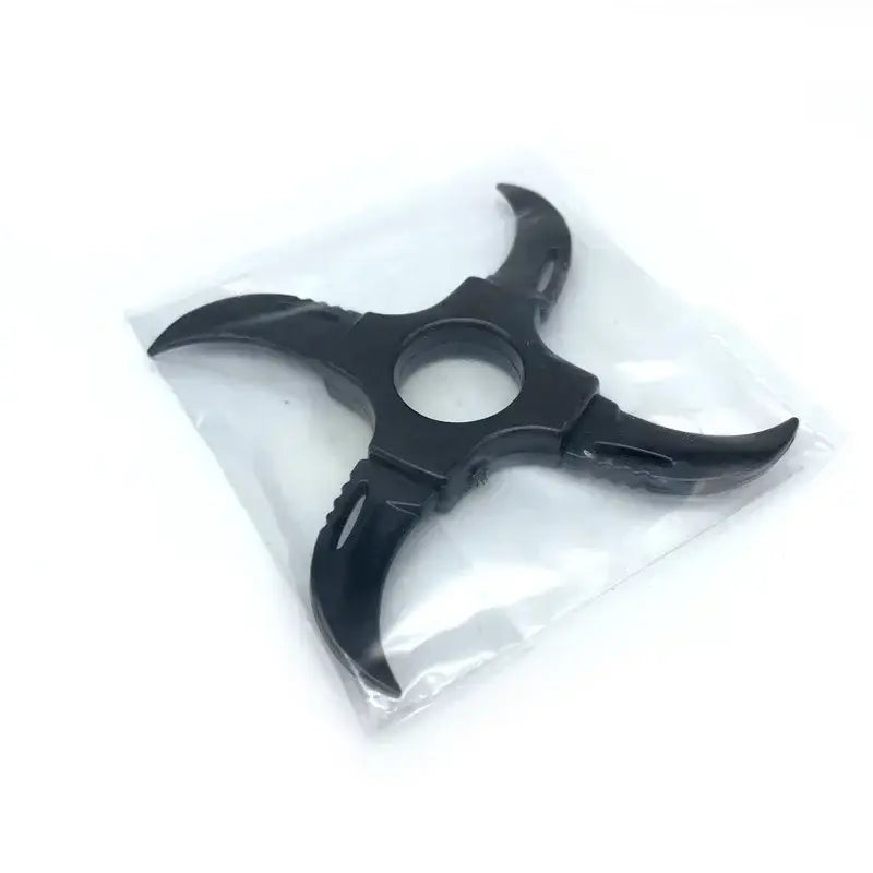 Black three-pronged shuriken kunai model with serrated edges made of durable PVC in clear plastic packaging