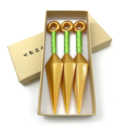Three golden kunai pvc weapon model with green wrapped handles in a beige box naruto shuriken kunai model