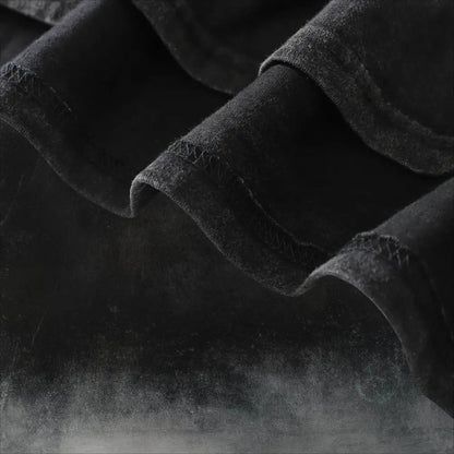 Black denim fabric with acid wash texture and visible stitching detail of naruto kurama oversized soft cotton t shirt