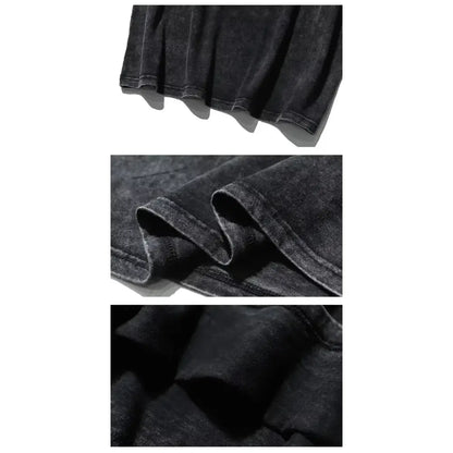 Black denim fabric with faded worn texture and visible stitching details on naruto kurama retro washed t-shirt vintage cotton tee