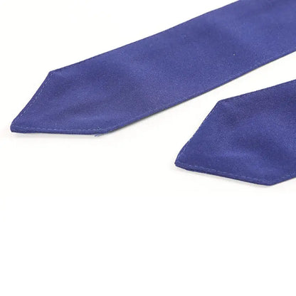 Deep blue satin ribbon with stitched edges on the back side of a Naruto ninja forehead protector band