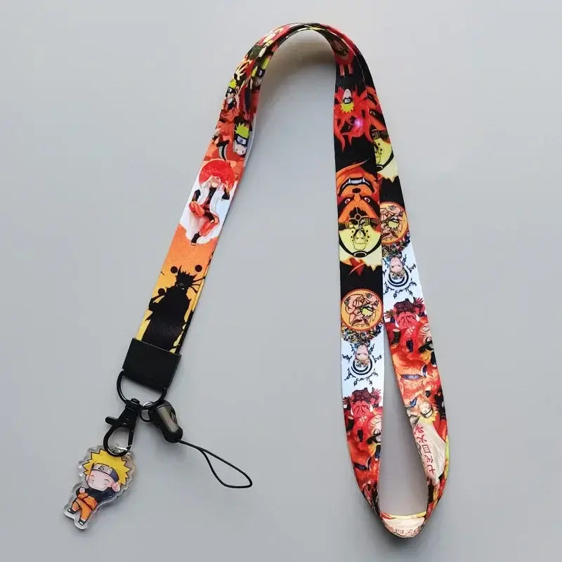 Naruto phone strap neck lanyard with vibrant orange black white prints and a clear acrylic charm cute cartoon accessory